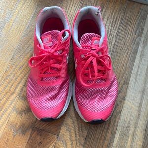 Pink Nike running shoes